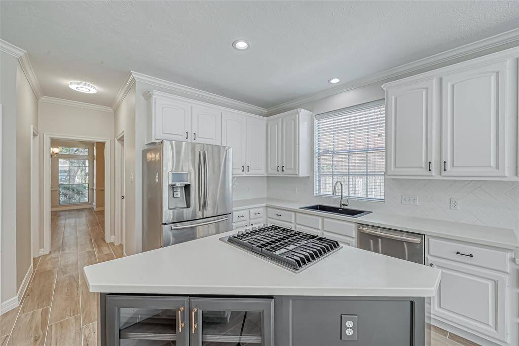 THE KITCHEN OFFERS STAINLESS STEEL APPLIANCES.