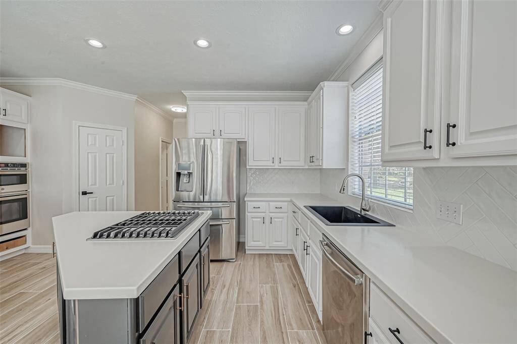 THE KITCHEN ALSO OFFERS A WALK-IN PANTRY.