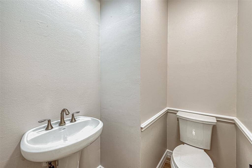 1/2 BATH LOCATED DOWNSTAIRS.
