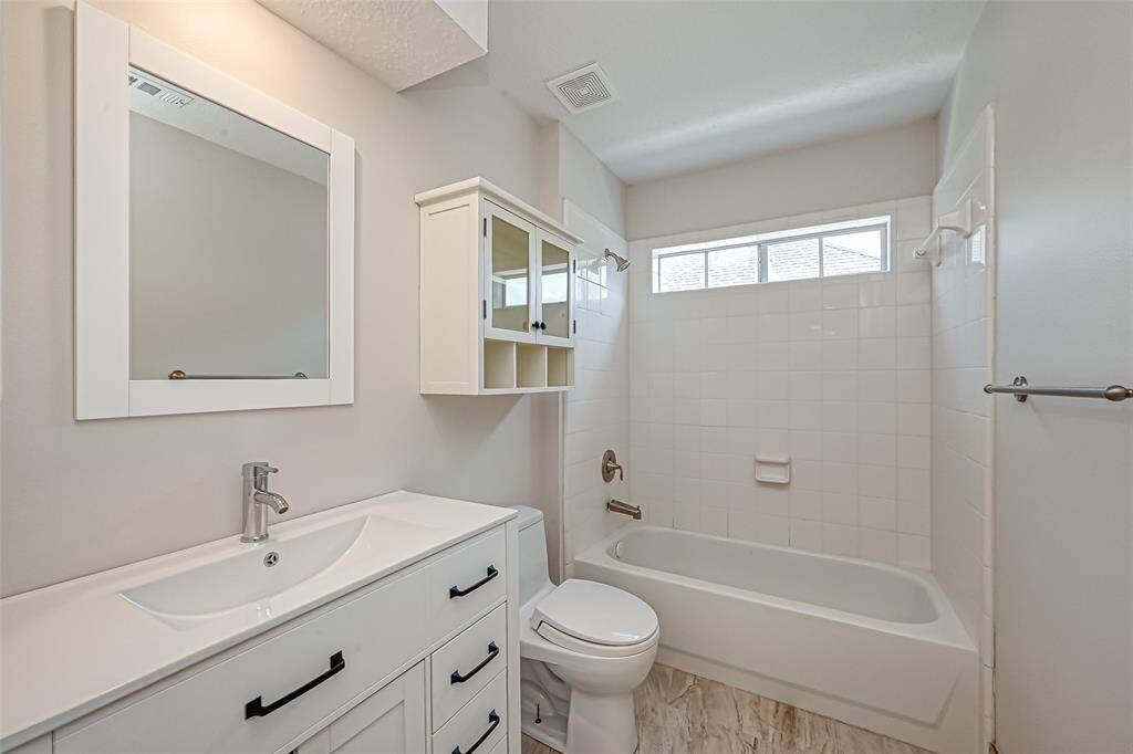 UPSTAIRS BATHROOM OFFERS A BEAUTIFUL SINK AND VANITY