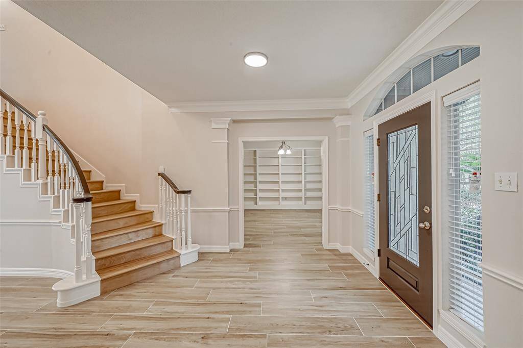SPACIOUS FOYER IS LIGHT AND BRIGHT. BE SURE TO TAKE NOTE OF THE UPGRADED FLOORING!