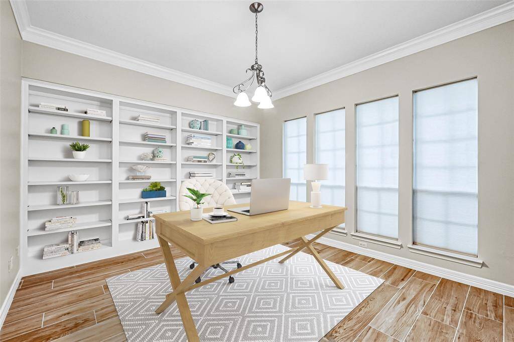 THE PRIVATE STUDY IS ON YOUR RIGHT WITH DOUBLE-FRENCH DOOR ENTRY AND A FULL WALL OF CUSTOM BOOKSHELVES.