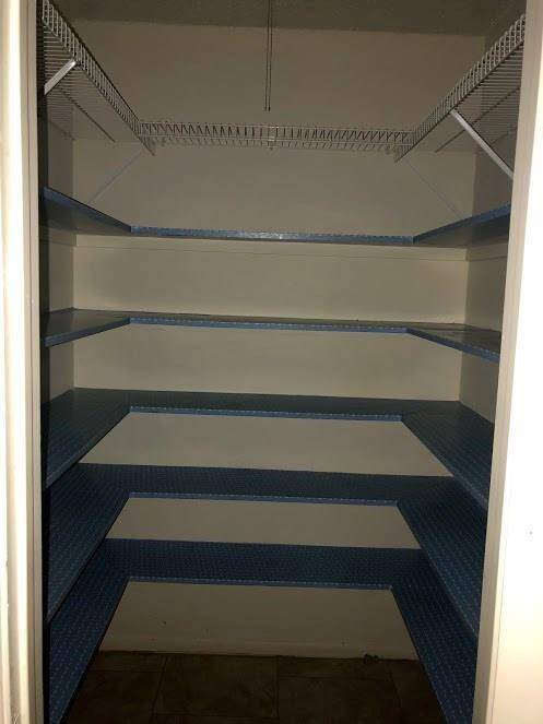 THE KITCHEN HAS A WALK-IN PANTRY
