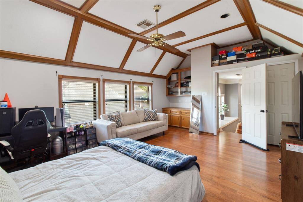 Beautiful wood floors, soaring decorative ceilings, and ample storage make this space versatile and inviting.