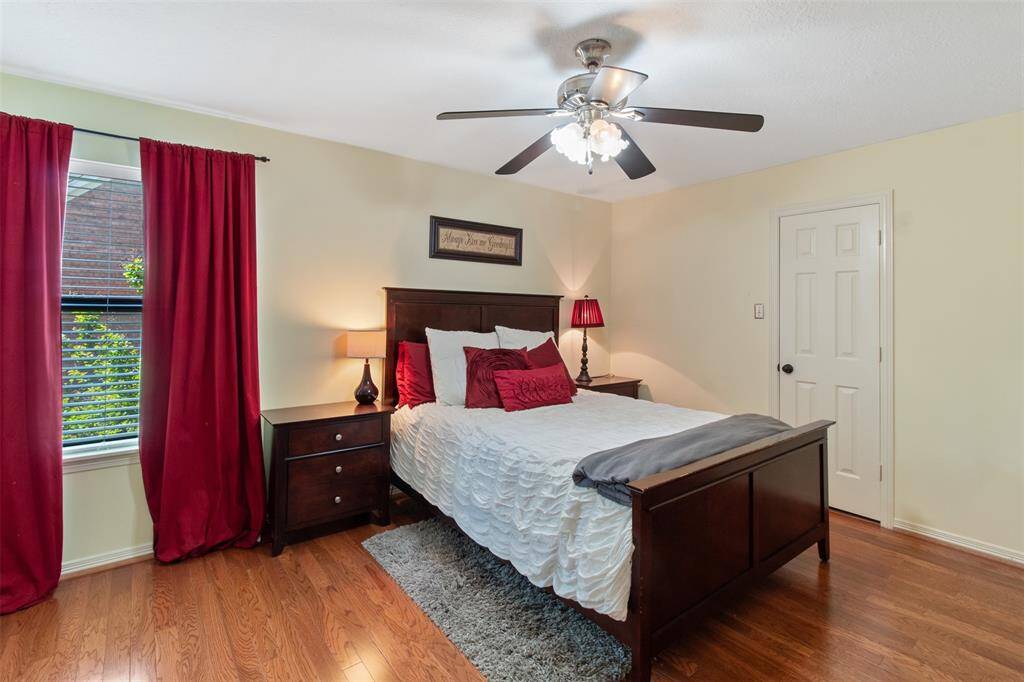Spacious upstairs bedroom with three closets for ample storage and plenty of room for additional furniture.