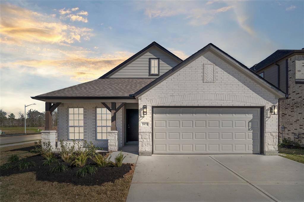 Welcome home to 1903 Scarlet Yaupon Way located in Barton Creek Ranch and zoned to Conroe ISD.