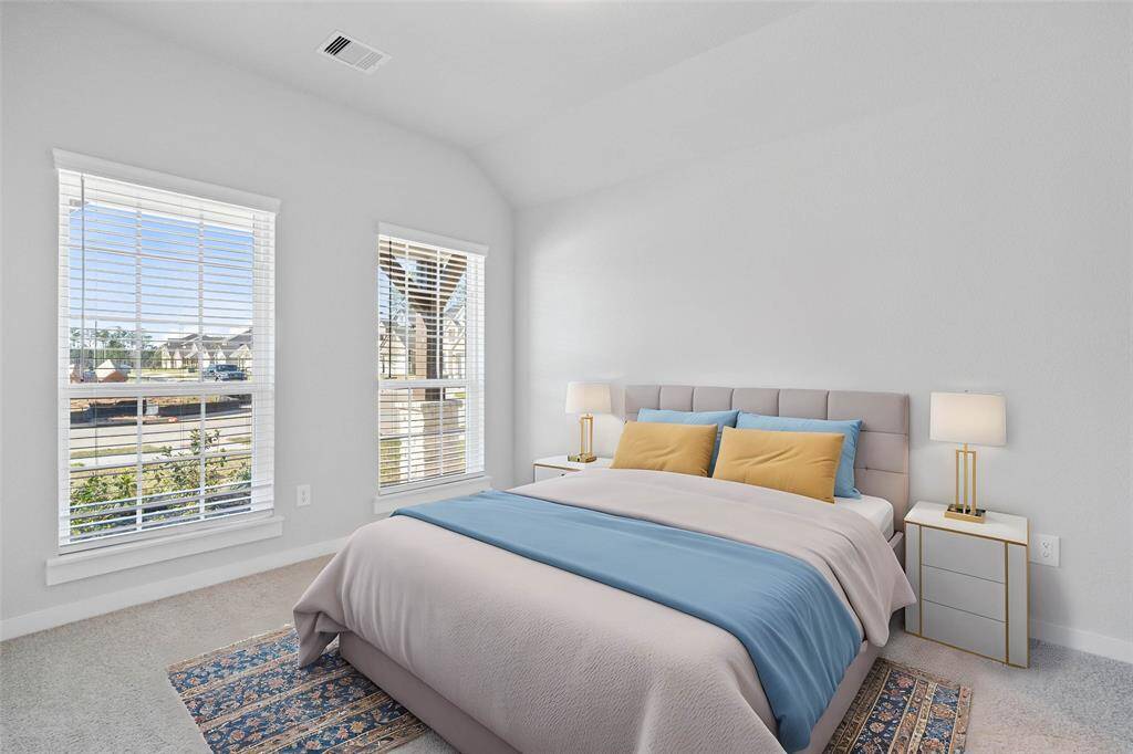The guest suite features plush carpet, custom paint, lighting, large window with privacy blinds, and its own private bathroom access.