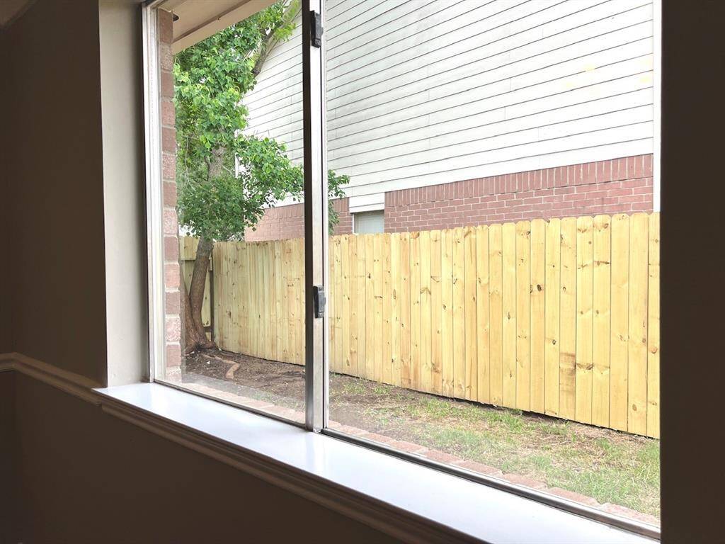 view from dining area. new side fence
