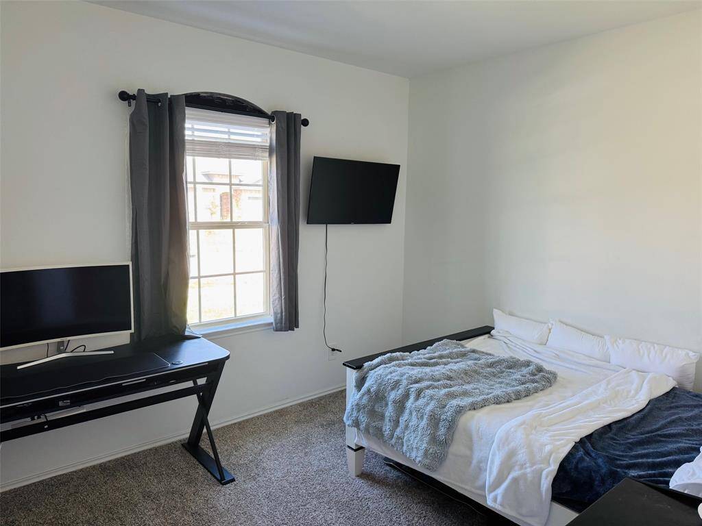 2nd bedroom with window and light