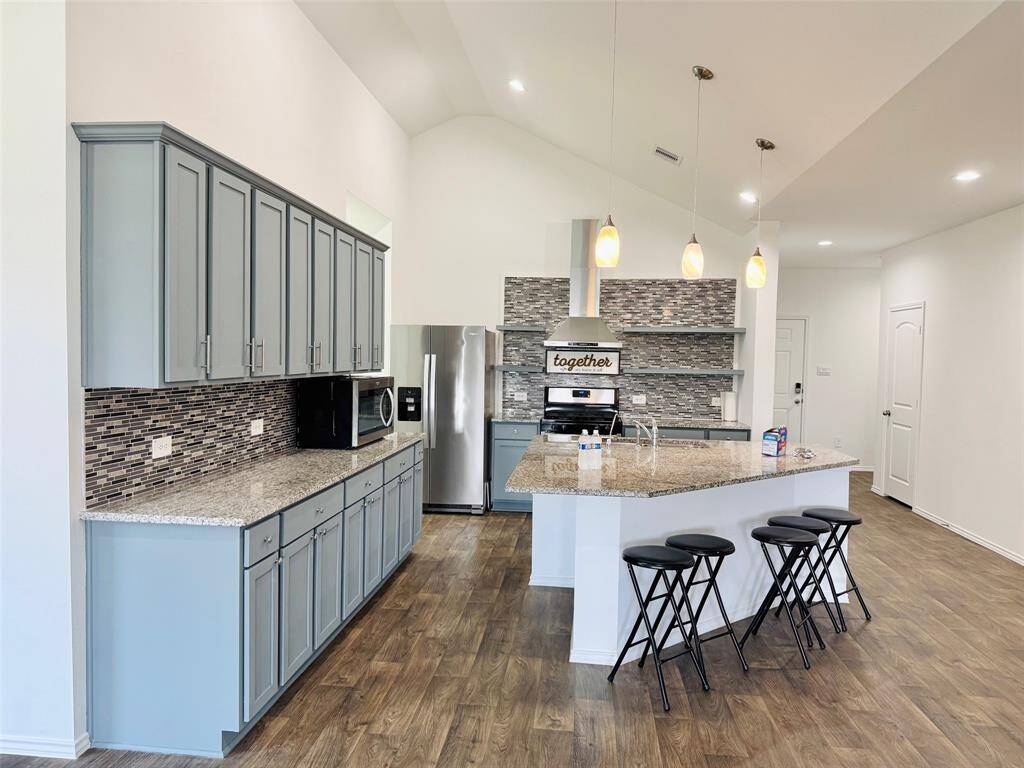 Cabinets standing tall against the walls, offer ample storage for cookware, and utensils.