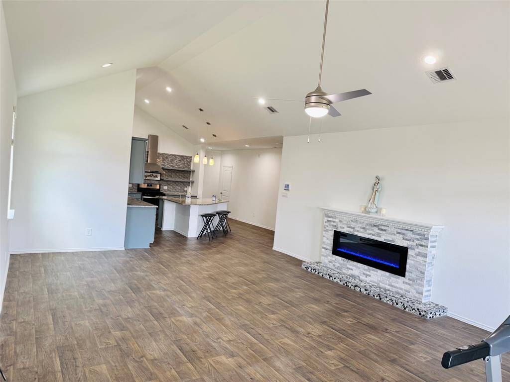 The family room is functional and creates an inviting atmosphere. Upgraded electric fireplace adding more value to the house