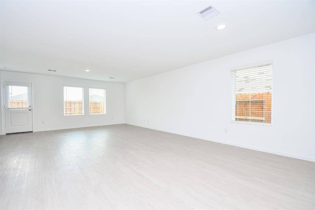 Natural light pours into the livingroom through the wall ofwindows.