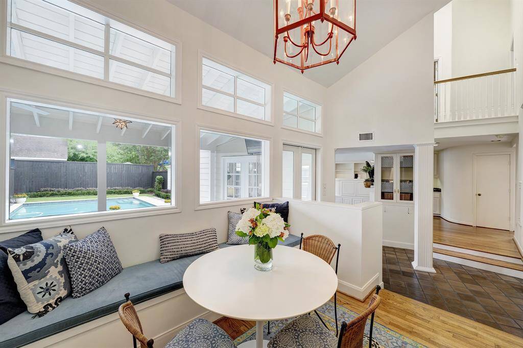The breakfast room [10'x 9'], den, bar niche, half bath and primary bathroom were added in 1980 by the previous owners. The architect masterfully designed a breathaking addition with lofted areas, soaring ceilings and dozens of oversized windows.