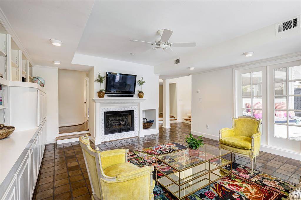 The back porch includes a pair of ceiling fans. This space also extends to the south where you'll discover a matching pendant underneath the eaves. This additional niche be a place for a mini summer kitchen.