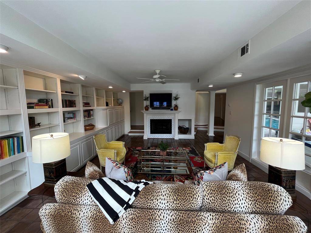 Historically, the sunroom [10' x 7'] was a screen porch (before an air conditioning system was added). As this residence was expanded over time, this space has been transformed for multiple uses.