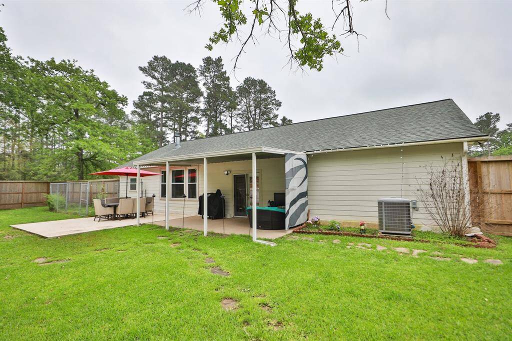 Covered back porch with extended concrete and sun barrier (can be removed)