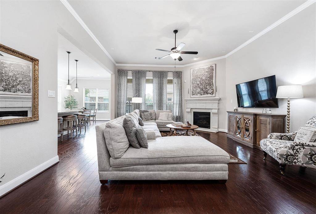 Formal living space features vaulted ceilings and a cozy gas log fireplace to relax.