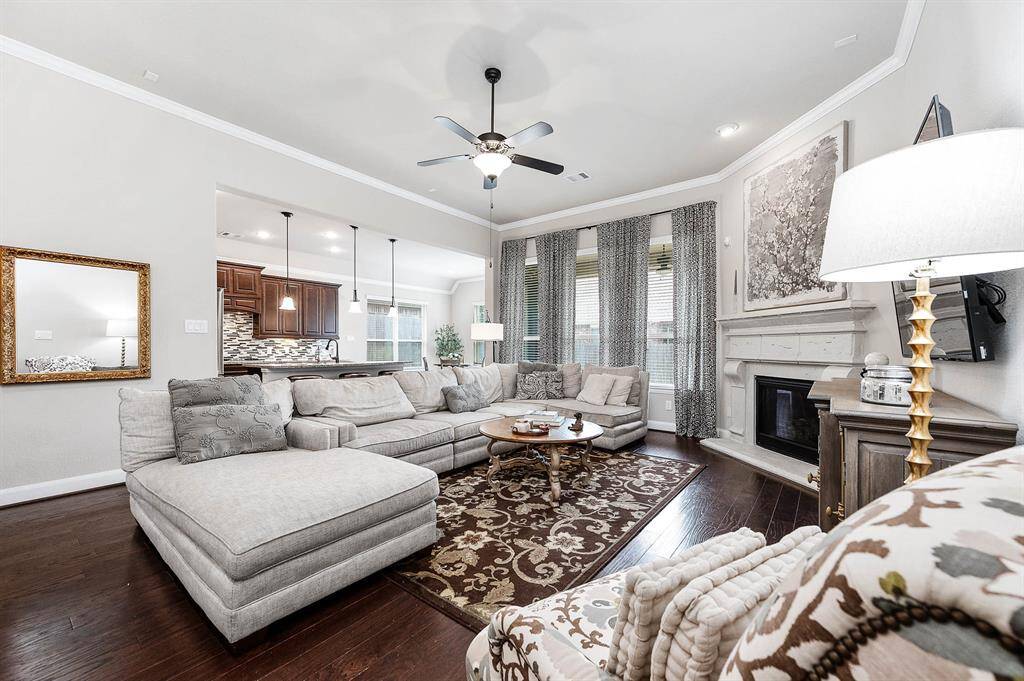 View from the formal living into the open concept kitchen and breakfast nook.