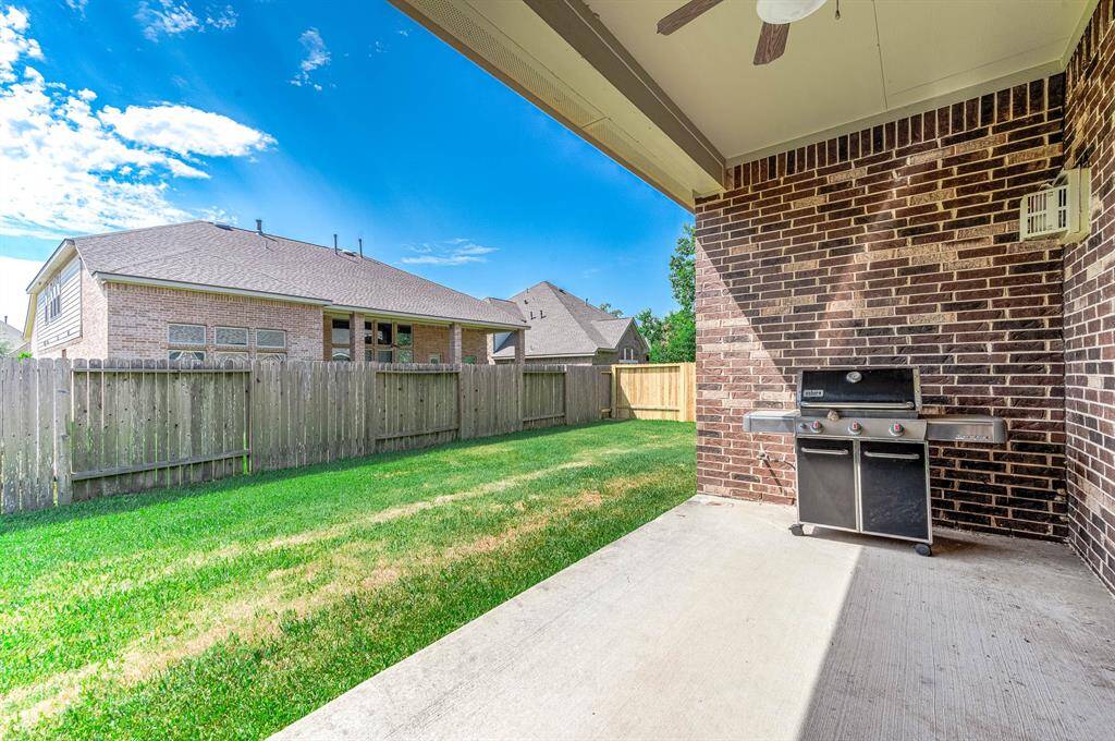 Covered patio off the back of the home.