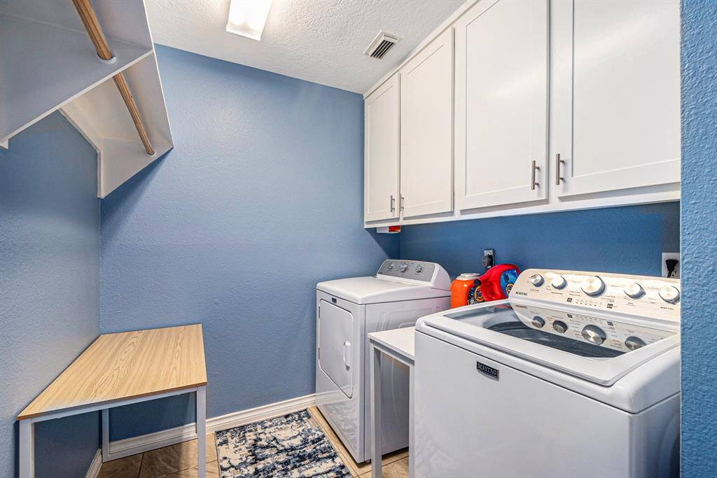 Laundry room with extra storage.