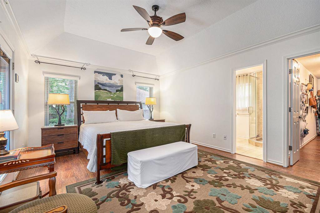 Beautiful primary bedroom with a massive closet, a private en suite, and access to the backyard.