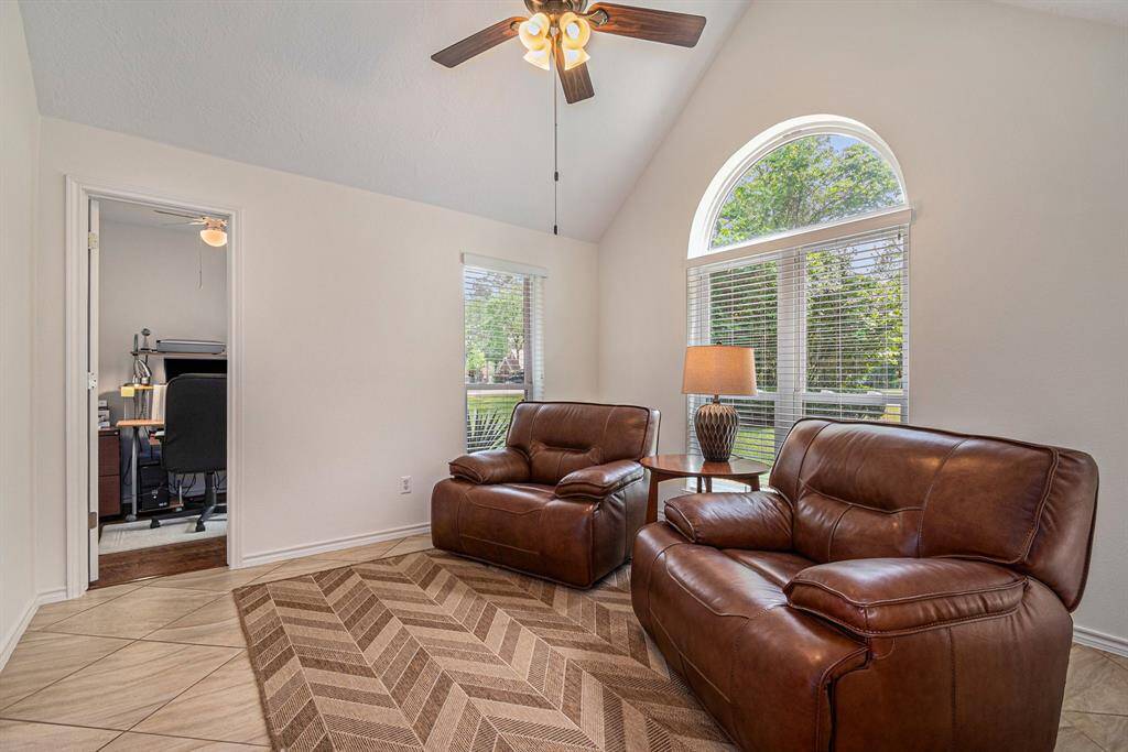 Charming flex space currently being used as a reading room and a home office nook.