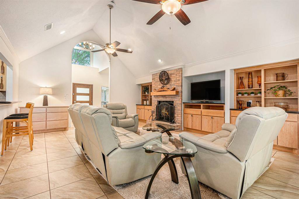 This amazing living room also has soaring ceilings and ample natural light.
