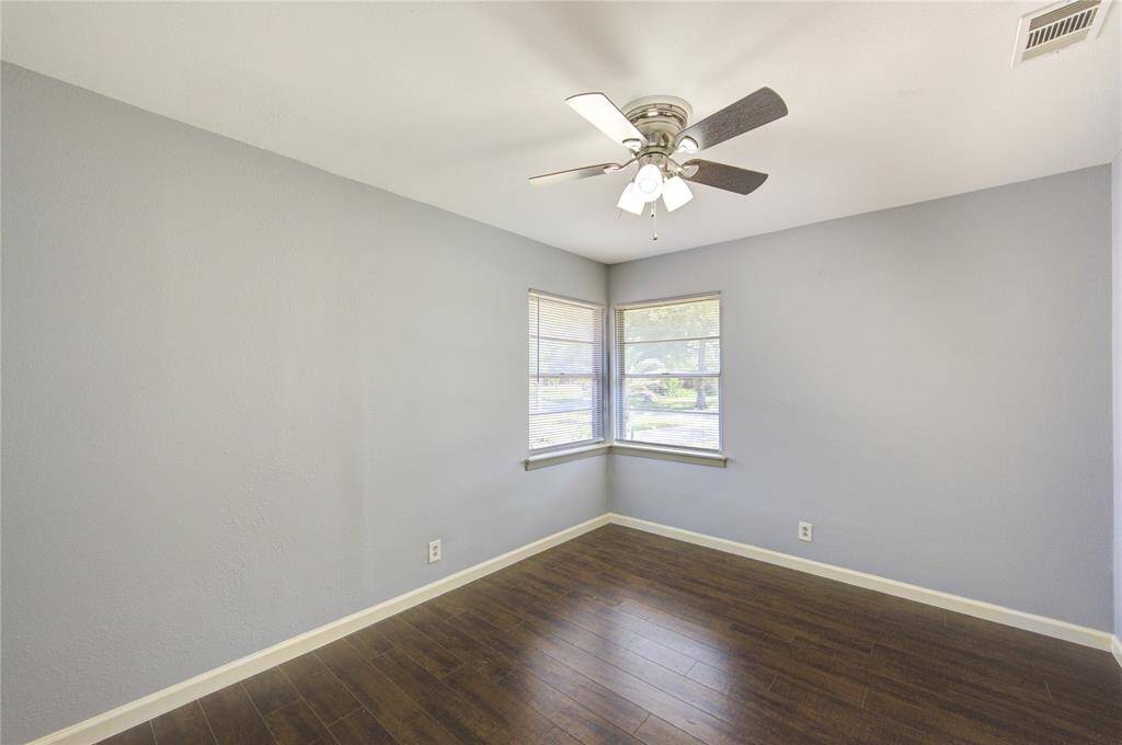 The third bedroom, located at the end of the hall