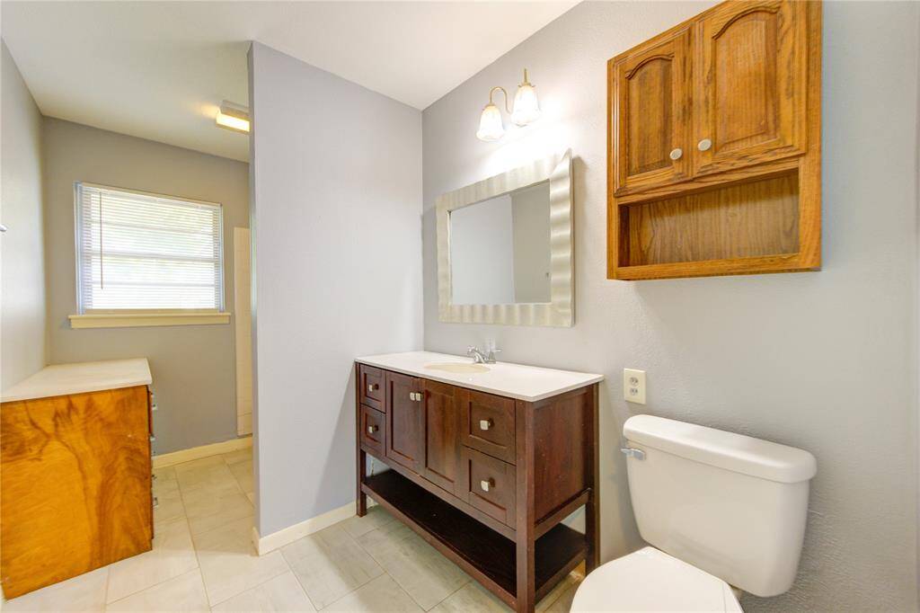 The bathroom includes a tub and shower, and built ins for storage