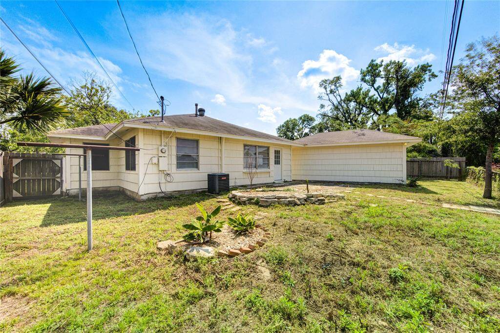 The backyard overlooks White Oak Bayou and has plenty of space to build a garden!