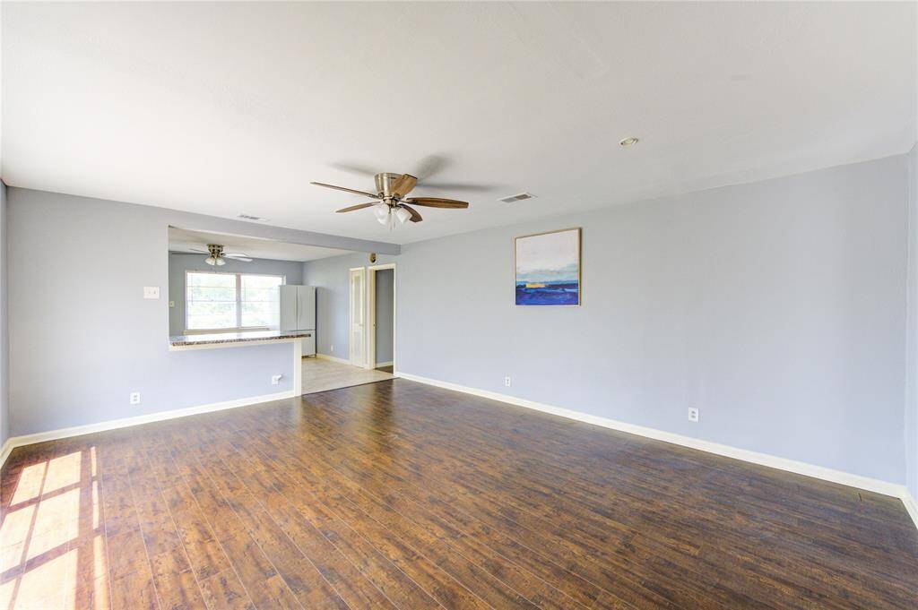 Entering the front door, you are greeted by a bright and spacious living room