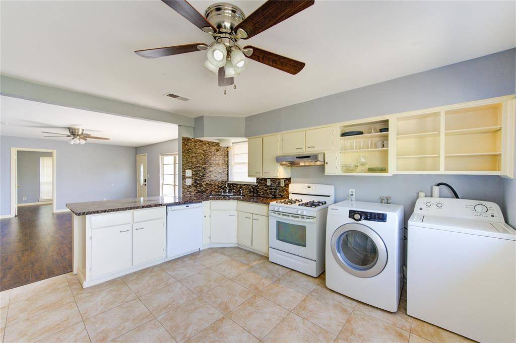 Alternate view of kitchen, open to the living room