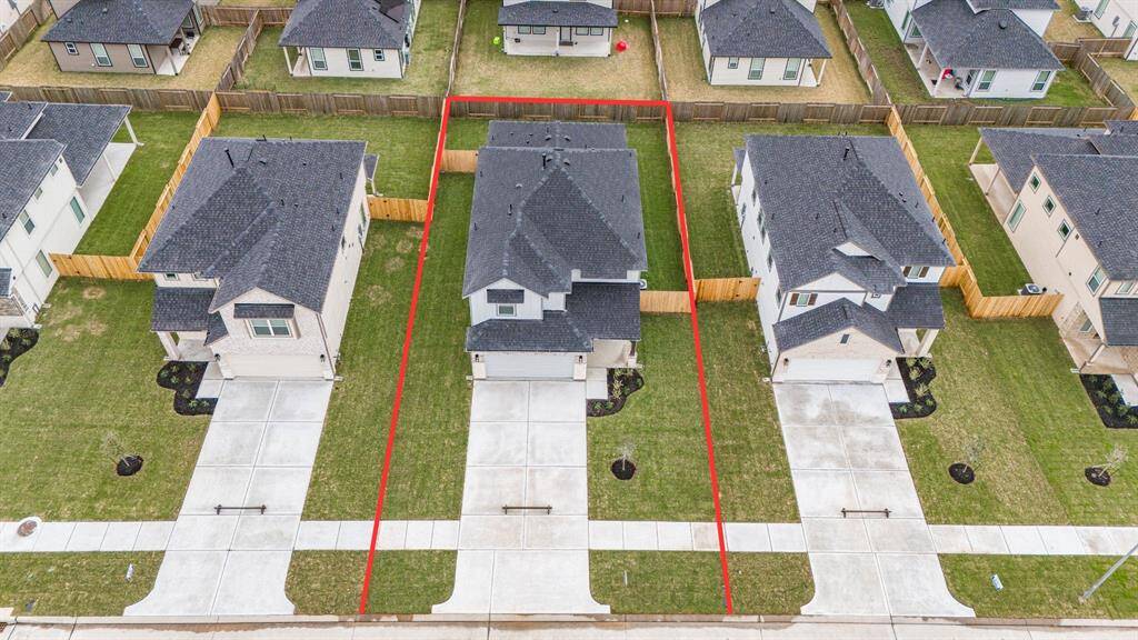 This home sits on a large lot with ample yard space in front and the back, lush landscaping and well-maintained yard!