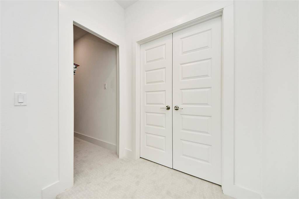 Built-in storage shelves and a spacious closet are tucked conveniently in the upstairs hallway, perfect for linens, games, or seasonal décor.