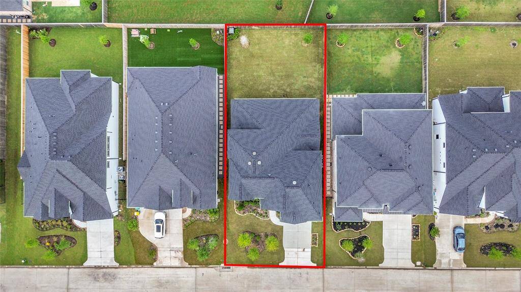 Bird's-eye view showcasing the full lot lines—highlighting the expansive backyard and its generous separation from neighboring homes.