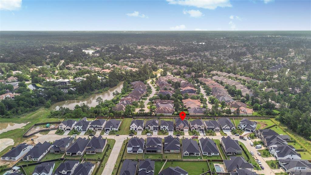 A wider angle capturing the home’s proximity to community greenspaces and the serene surroundings of the neighborhood.