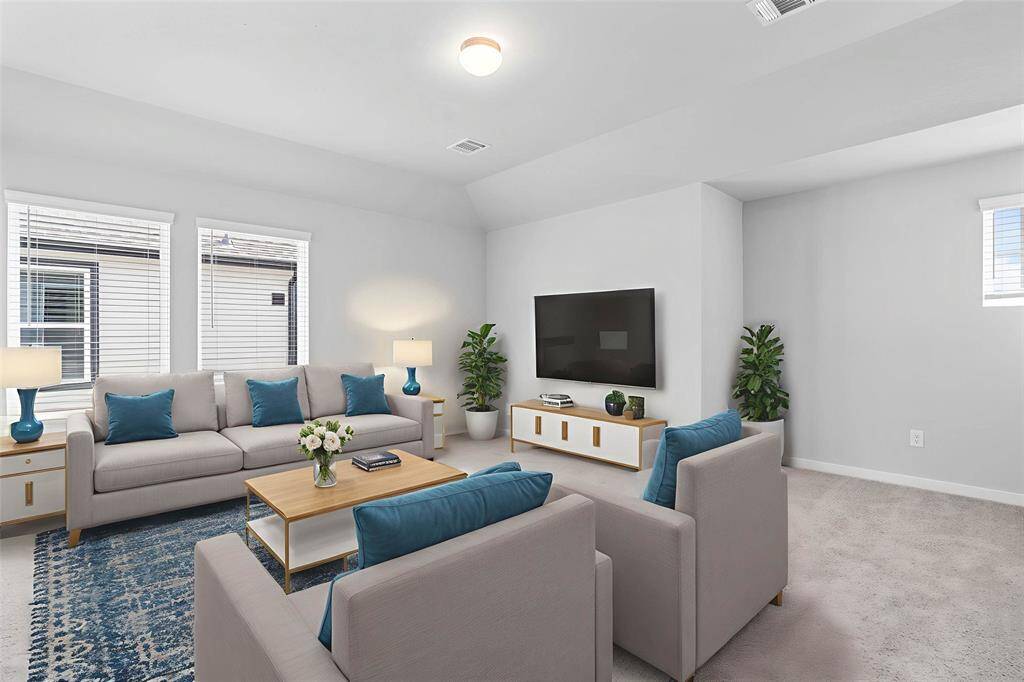 This spacious and bright room features custom paint with gorgeous plush carpet, and large windows with privacy blinds! With the ample amount of space provided, you can turn this area into anything!