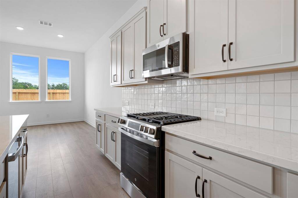 This kitchen is not only a functional space but also has ample storage. Whether you're a seasoned chef or just love to gather and enjoy good food, this kitchen is a dream come true.