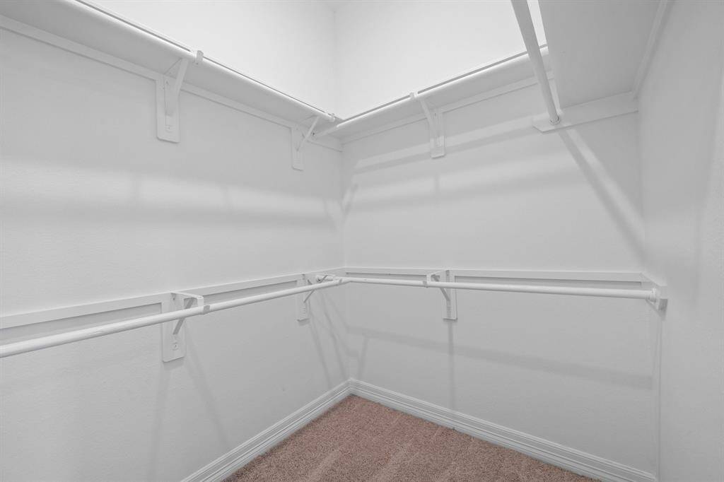 A view of your large primary walk-in Closet