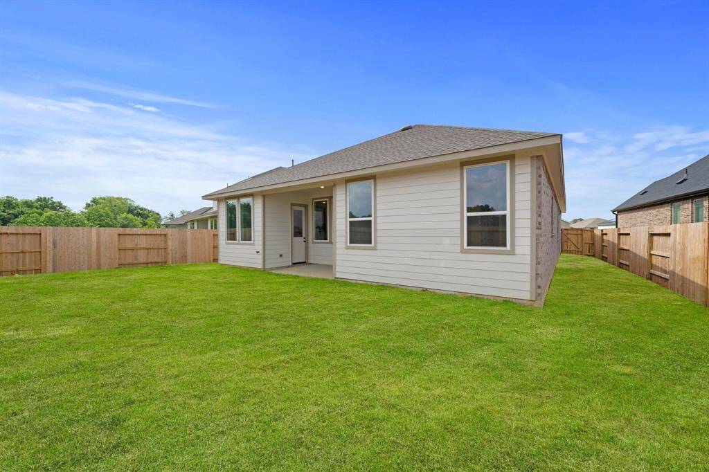 This backyard is perfect for family gatherings, social events, or simply unwinding in the fresh air.
