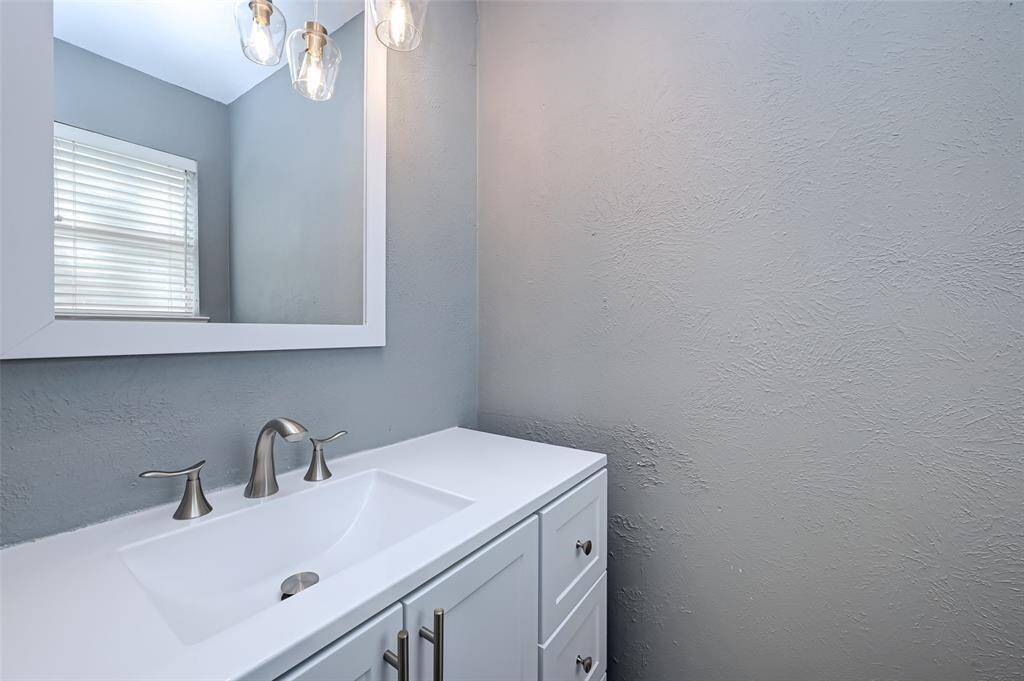 The half bathroom has plenty of storage space.