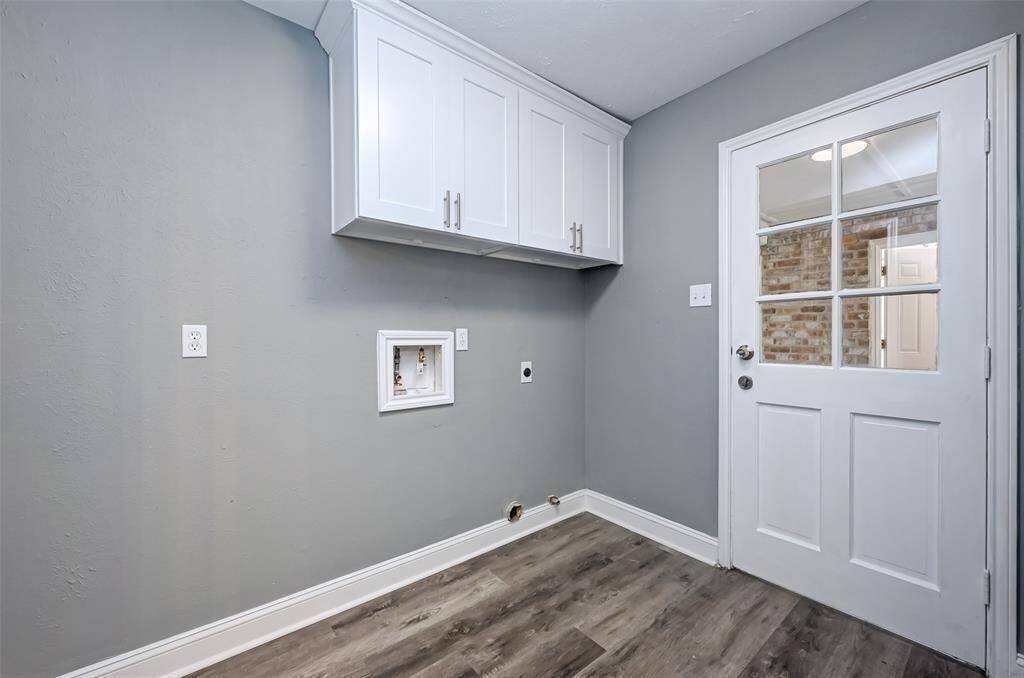 The laundry room features washer and dryer connections, andplenty of storage space.
