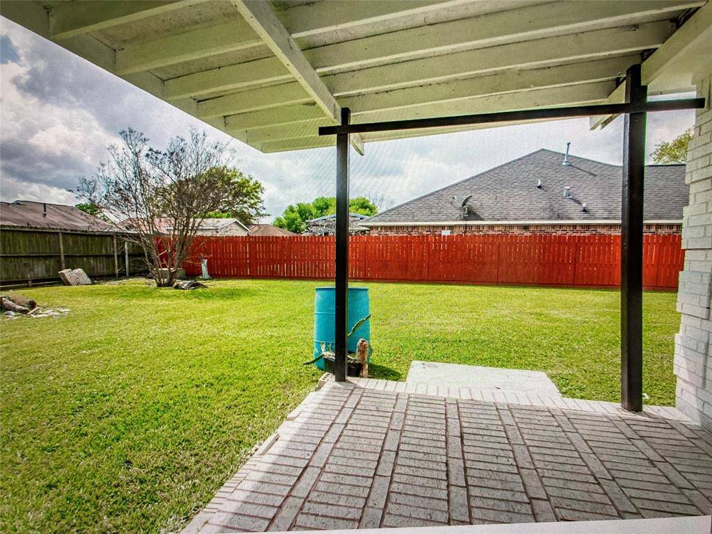 COVERED PATIO IN BACK YARD.