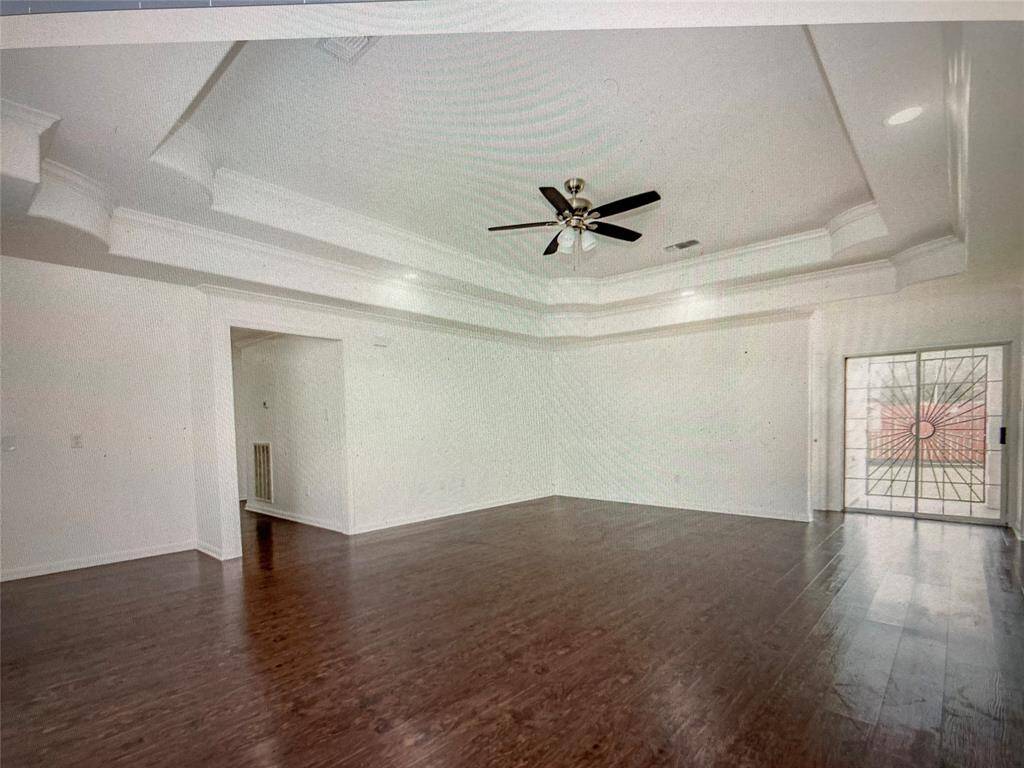 ALTERNATE VIEW OF LIVING ROOM W/ VIEW OF PATIO DOORS LEADING TO BACK YARD