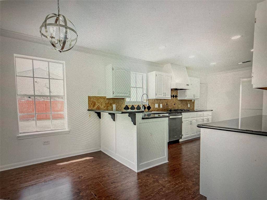 ALTERNATE VIEW OF KITCHEN AND BREAKFAST ROOM