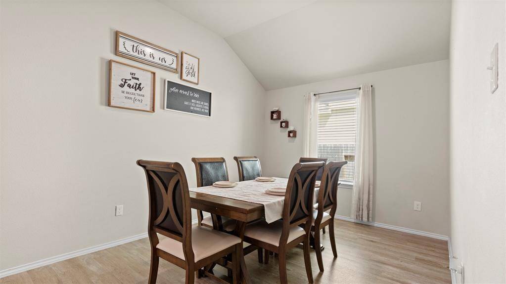 Dining area located next to the open concept kitchen / living area.