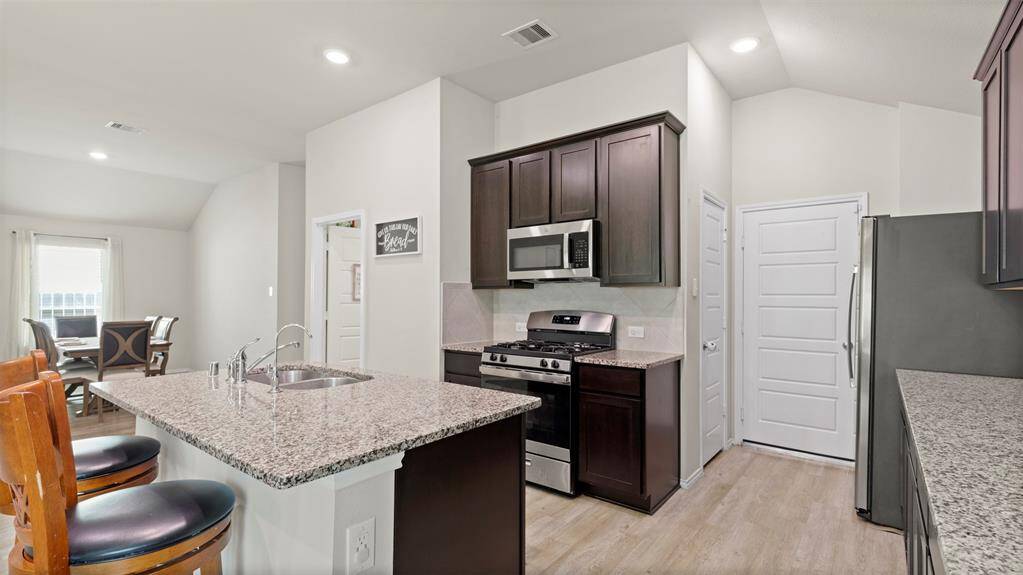 Nice, open kitchen area with ample storage.