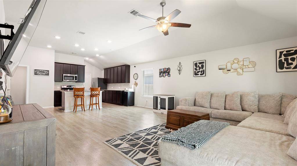 View of the open floor plan showing the kitchen and living area.