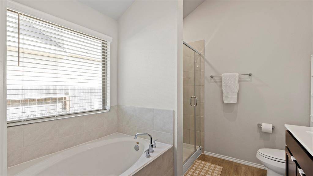 Separate shower and soaker tub.