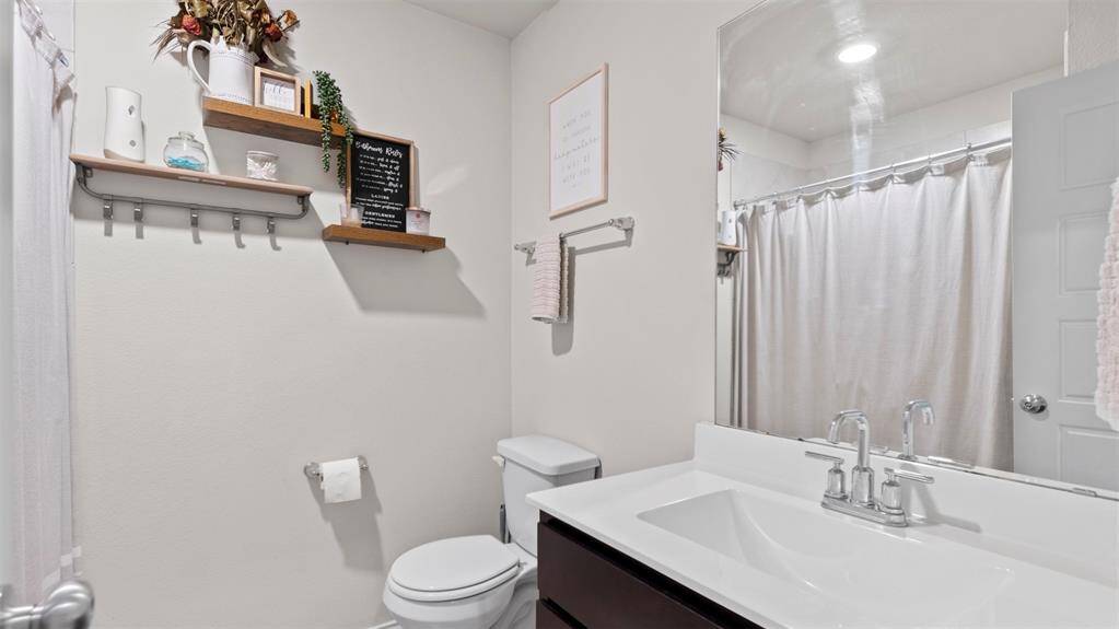 Full bath nestled in between the two secondary rooms once you enter the home.